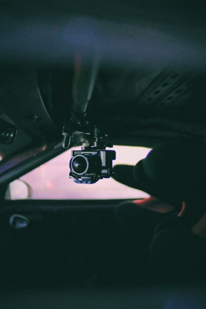 Selective Focus Photo of of Black Camera Inside Vehicle