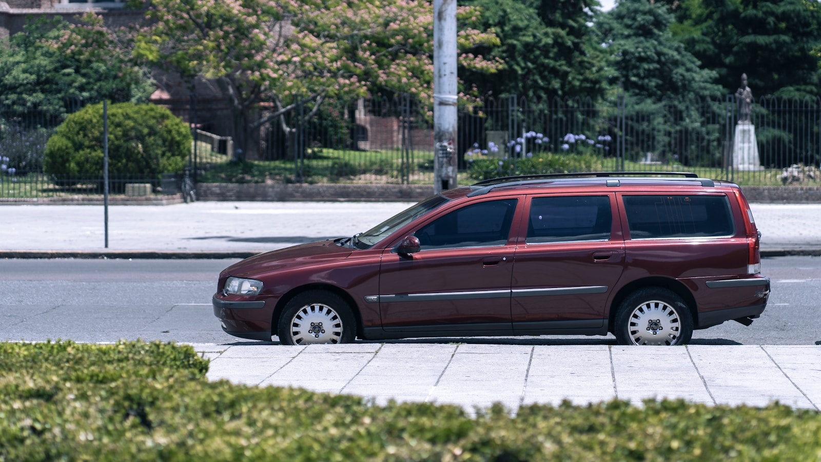 a red van parked on the side of the road