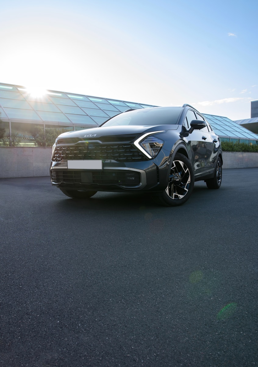 a black car parked in front of a building