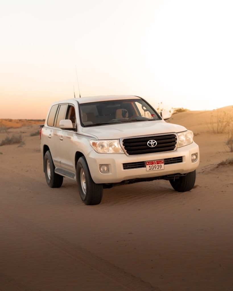 White SUV on Brown Sand