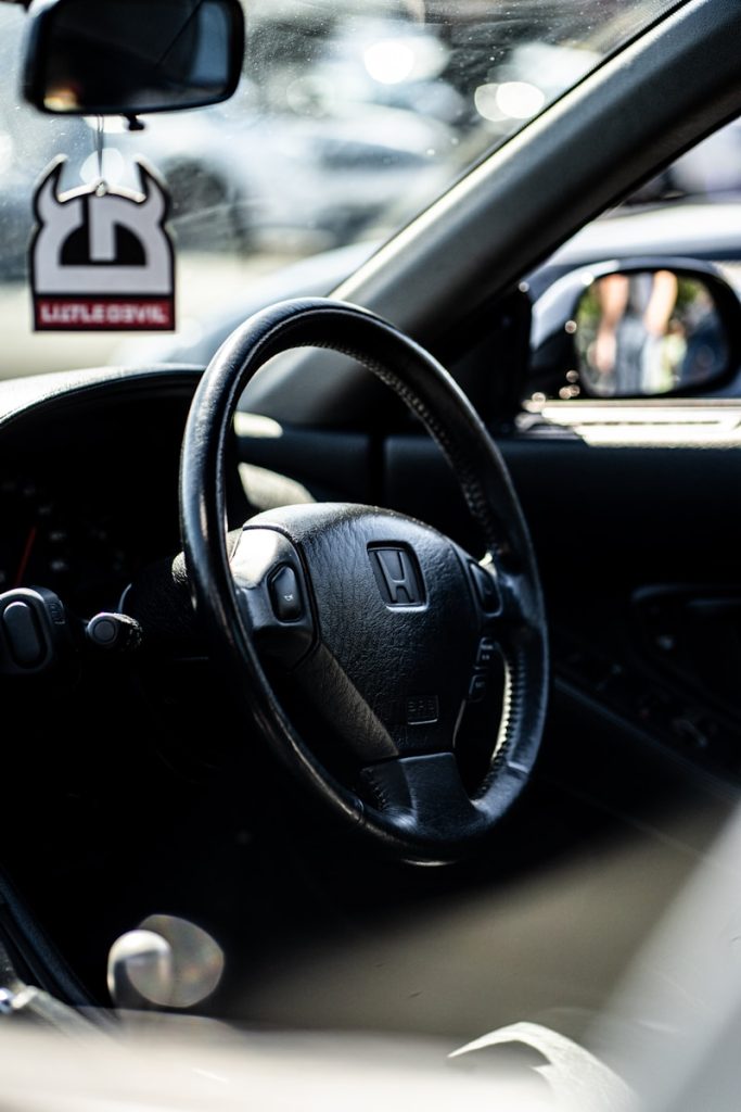 a steering wheel and dashboard of a car