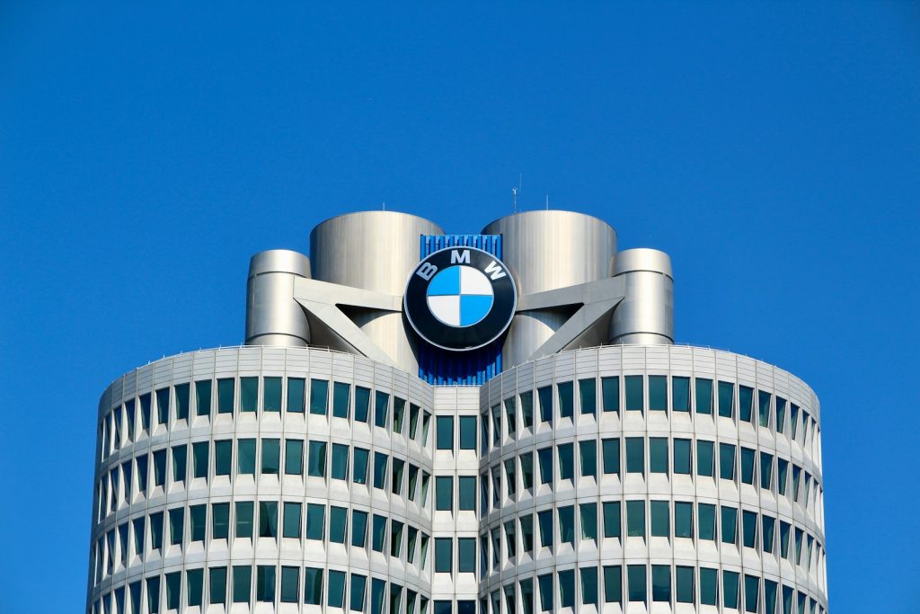 a tall building with a bmw logo on top of it