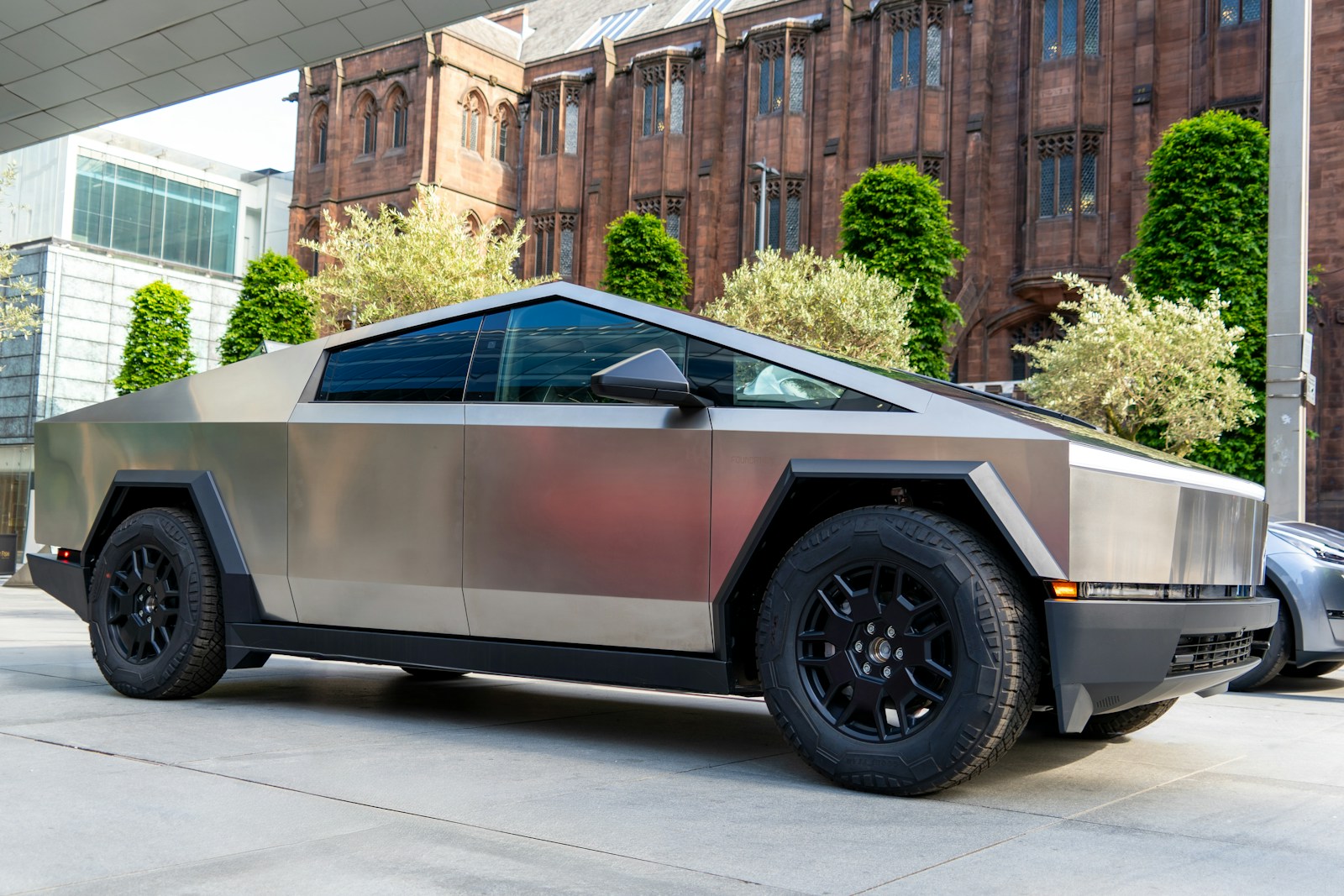 a futuristic car parked in front of a building