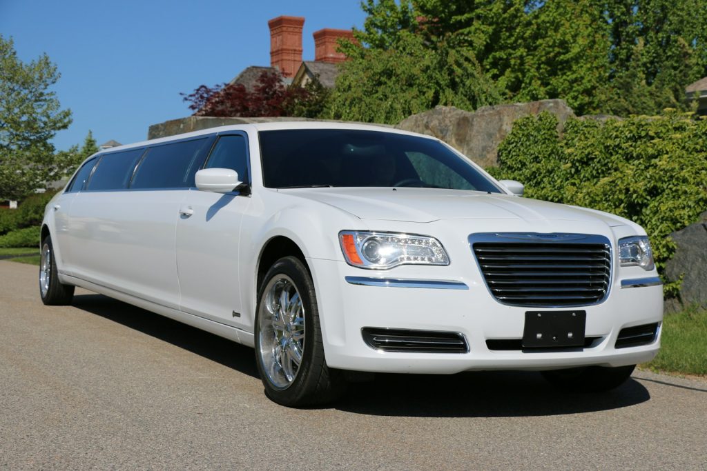 a white car parked on the side of a road